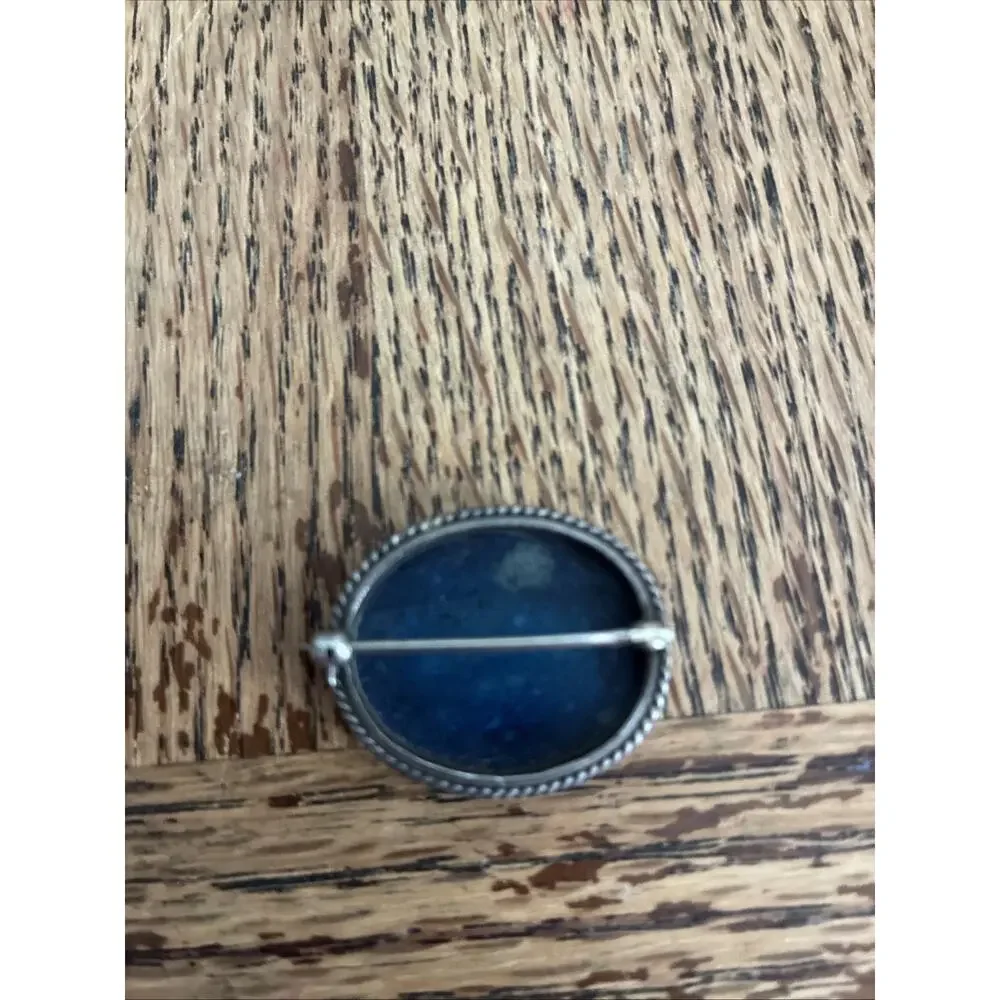 A Vintage Navajo Sterling Silver Sand Cast Brooch With A Lapis Cabochon